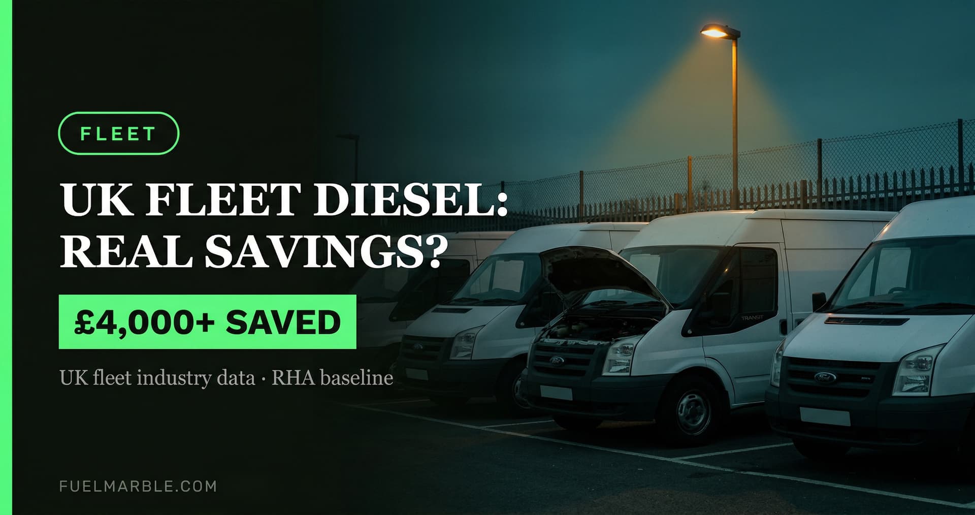 White Transit vans parked at a commercial depot yard at dusk with one bonnet raised under a sodium lamp