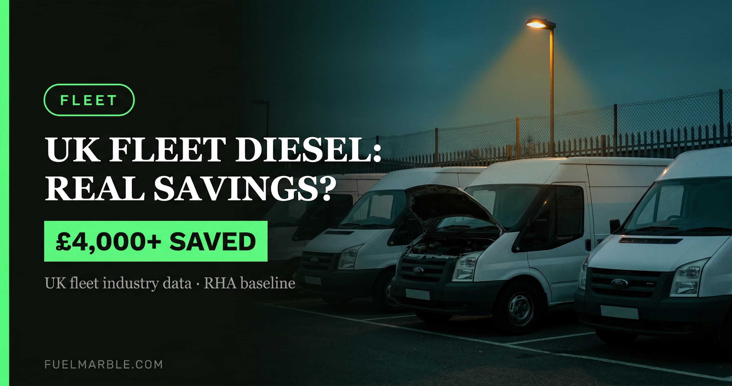 White Transit vans parked at a commercial depot yard at dusk with one bonnet raised under a sodium lamp